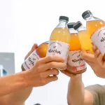 Cheers with Alocha kombucha