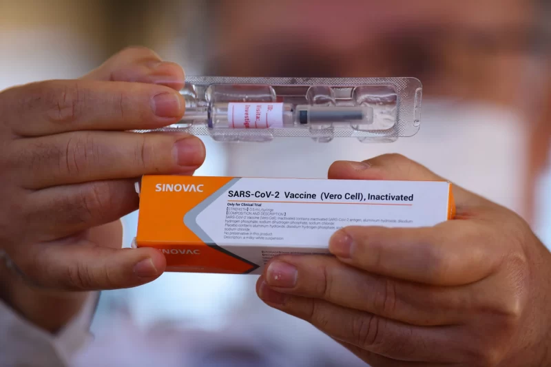 Someone is holing a Sinovac vaccine