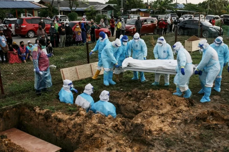 A lot of medical staff is carrying a coffin