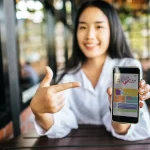 A girl showing the application of OurCheckup