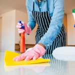 Close up of woman cleaning her house
