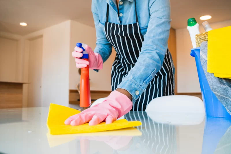 Close up of woman cleaning her house