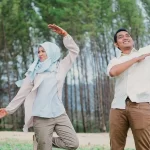 Muslim husband and wife doing outdoor exercise together