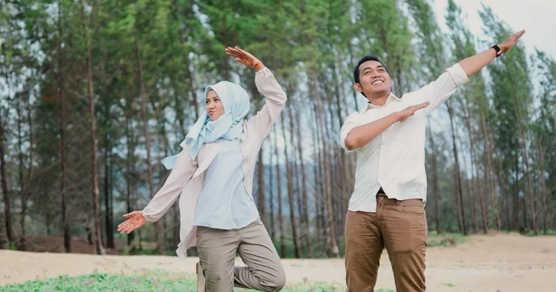 Muslim husband and wife doing outdoor exercise together