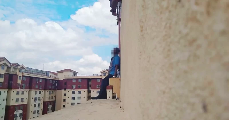 Someone standing at the edge of a building
